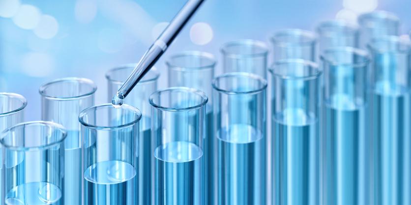 A close-up of blue liquid in test tubes