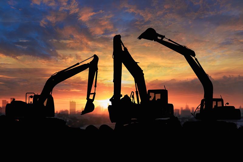 Bulldozers at sunset