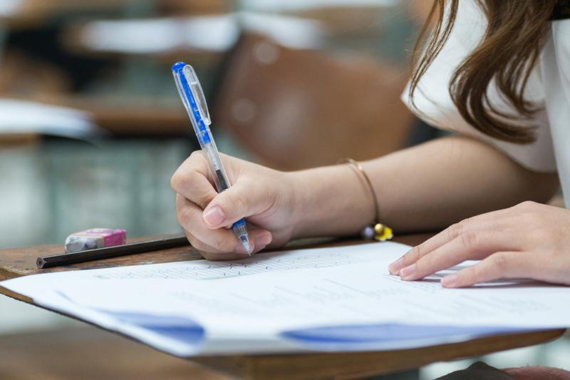 Female student doing handwritten exam