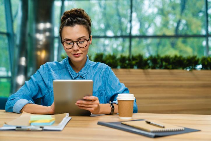 A young entrepreneur works on an iPad