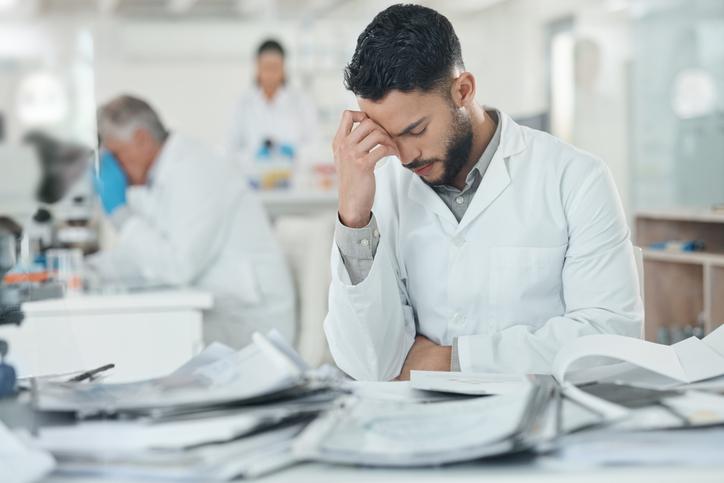 A science student struggles in a lab