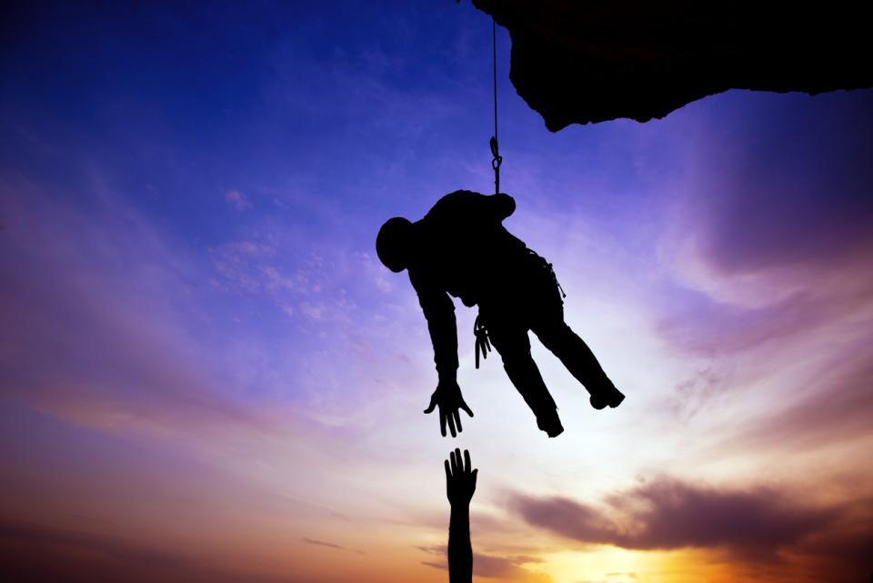 An abseiler catching a falling colleague