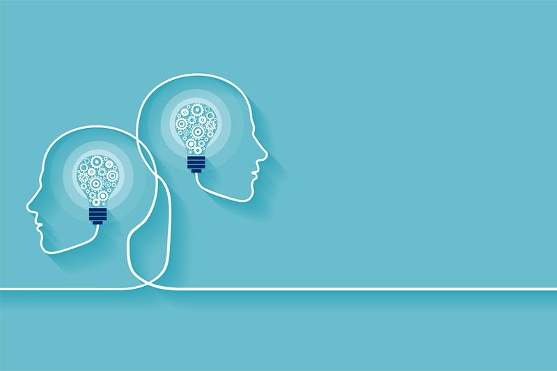 Illustration of two head outlines with lightbulbs