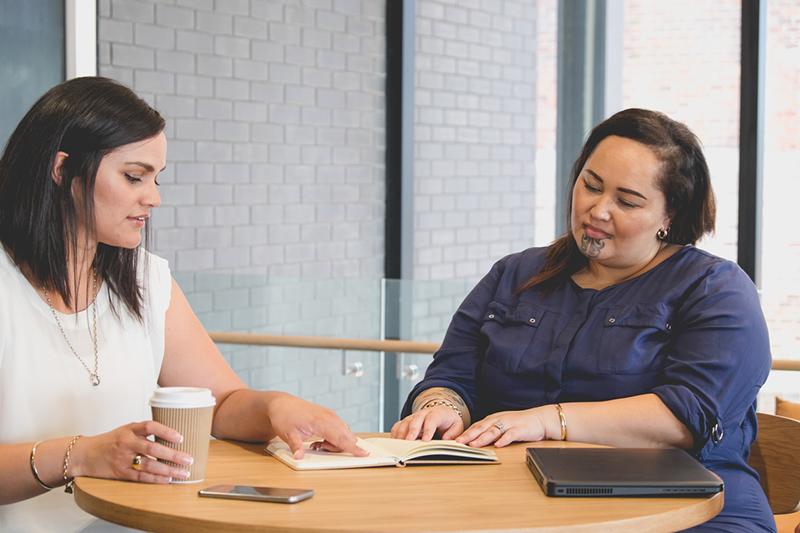 Two Maori women in a meeting