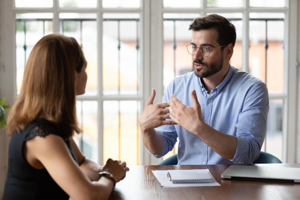 A student and an assessor roleplaying a client meeting