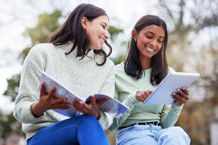 Two female students study together