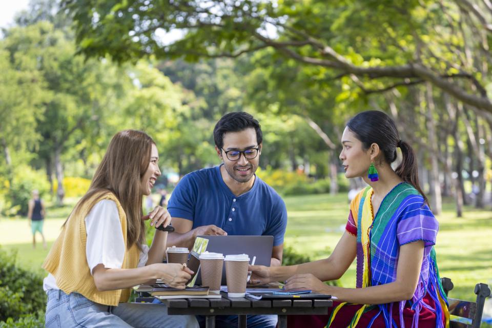 Students chatting in a green space