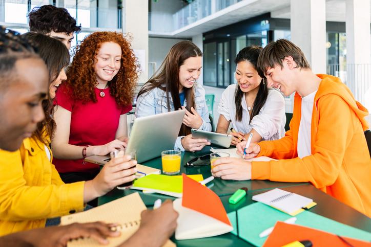 Students work on a project round a table