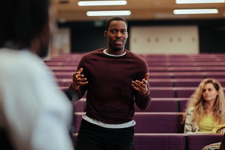 A young student stands up to make a point