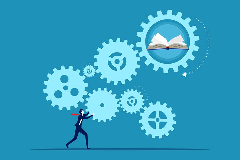 Illustration of man pushing cogs linked to books representing work-integrated learning