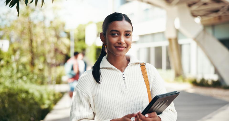 A student smiling to camera