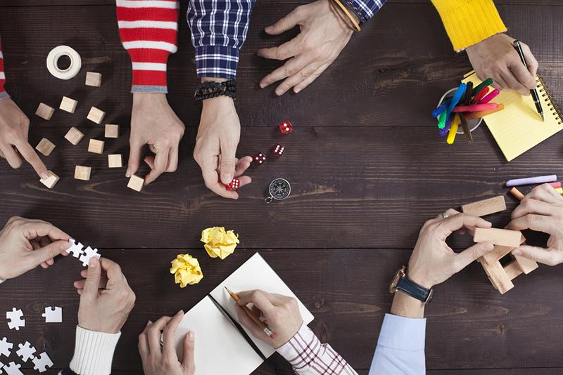 Details of hands playing different games