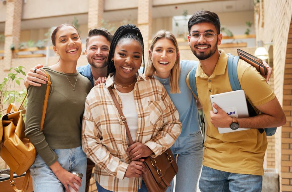 A group of international students smiling to camera