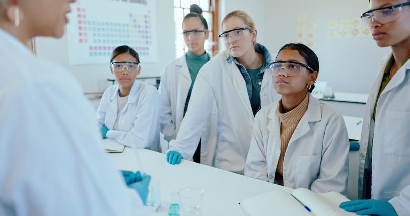 Students in a lab listen to the instructor