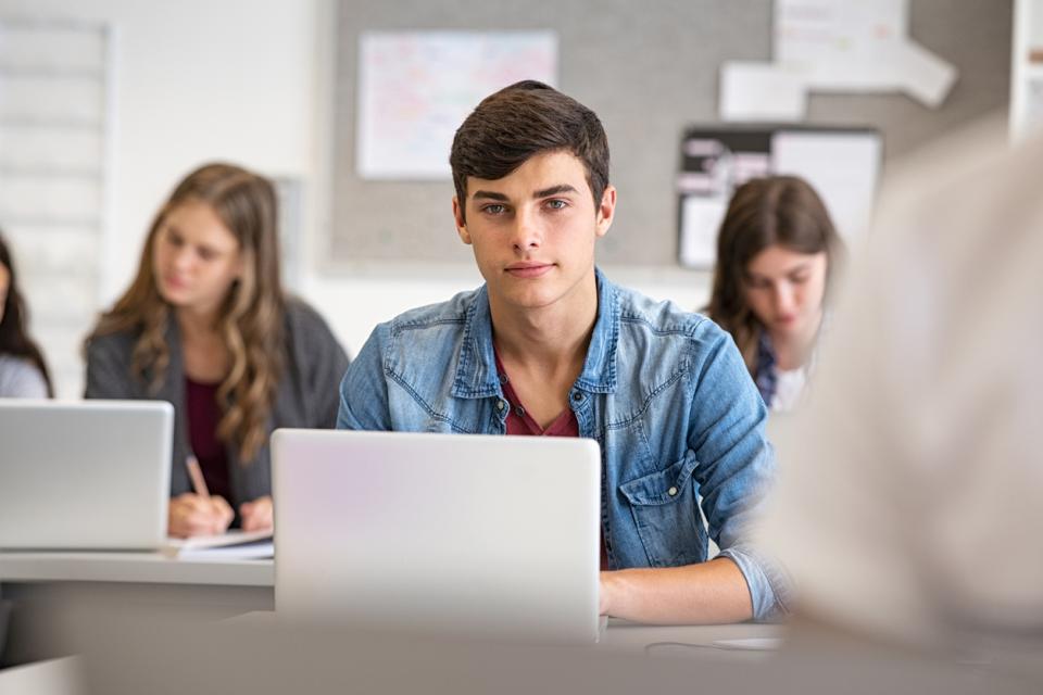 Good looking male student in a university class
