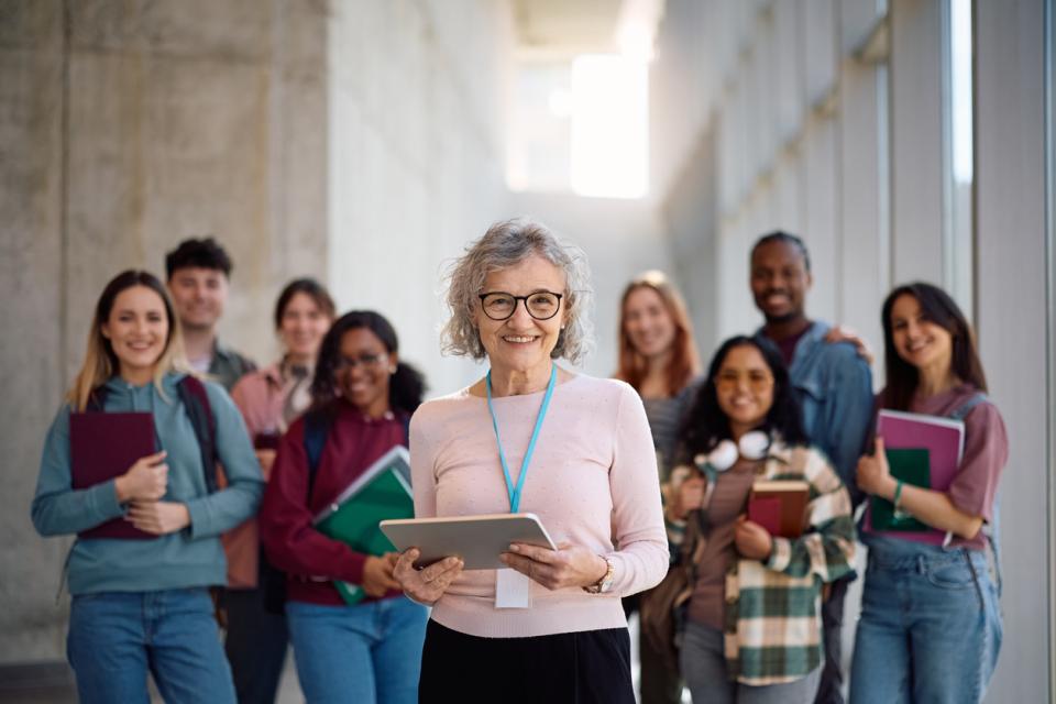 University staff smiling to camera