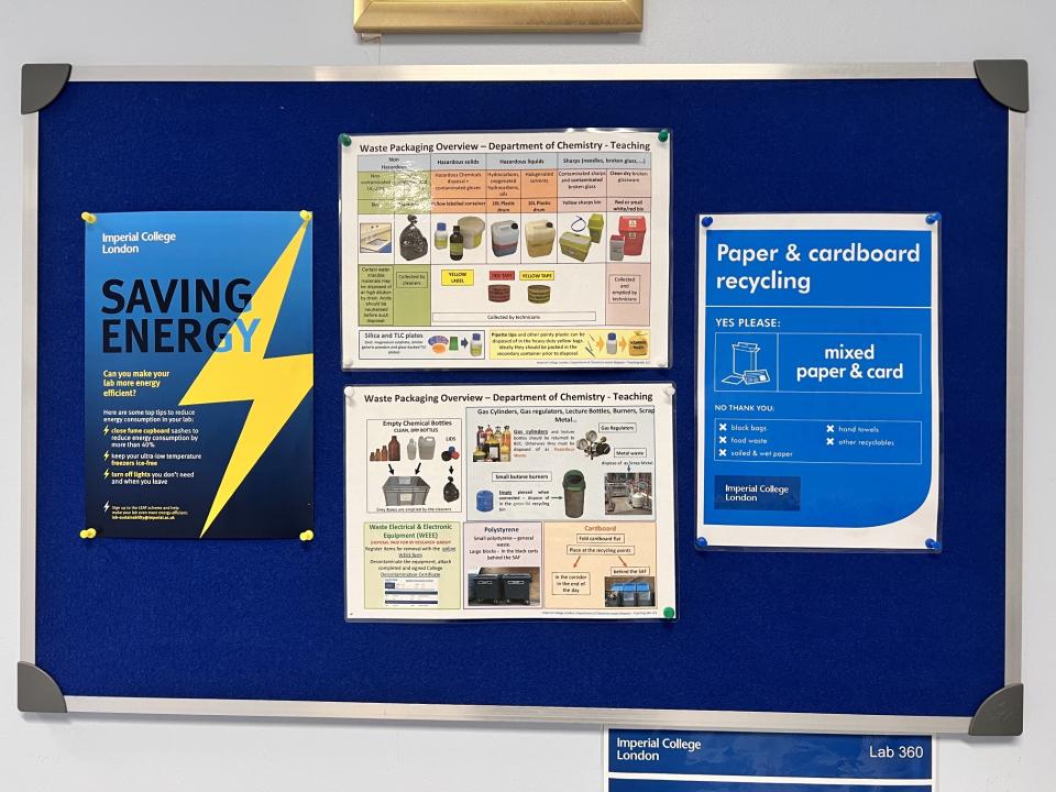 A noticeboard with posters guiding students about how to reduce waste in a lab