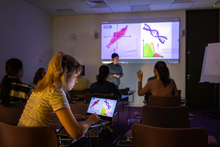 STEM students watch and interact with a classroom presentation