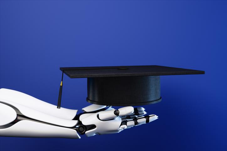 Robot hands hold a mortarboard
