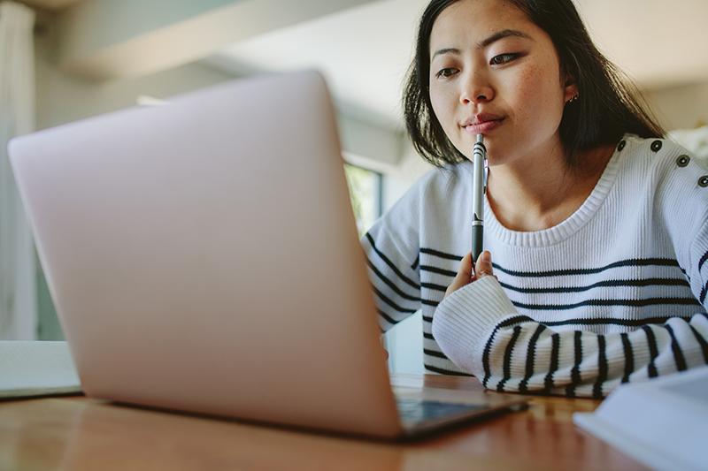 Asian woman studying at home