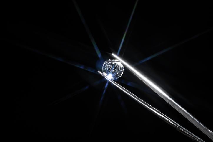 A diamond held by tweezers