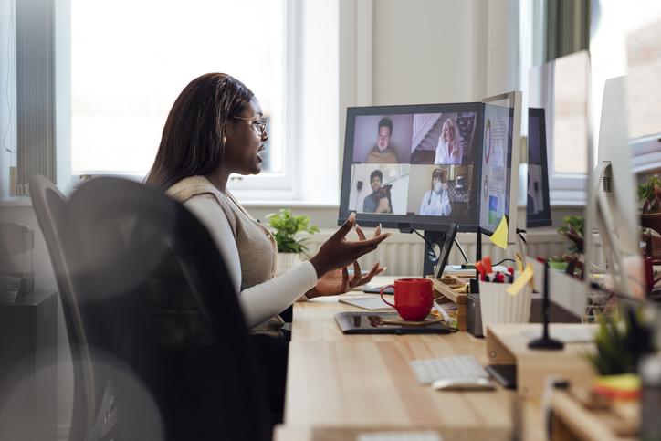 A student on a zoom call in her home office