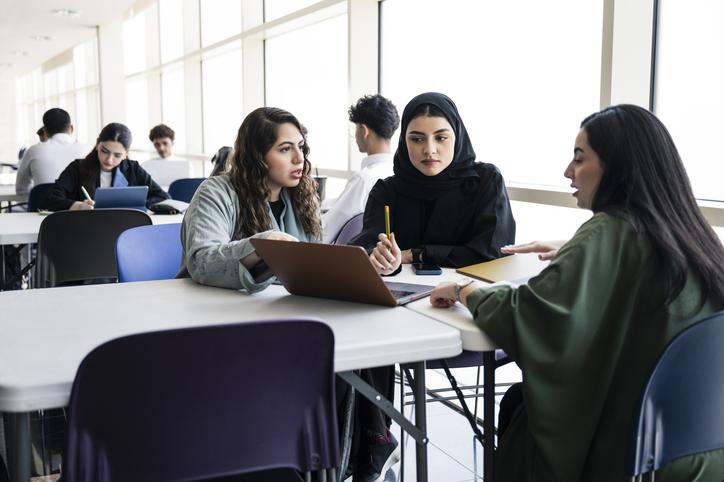 Muslim law students discussing a case in class