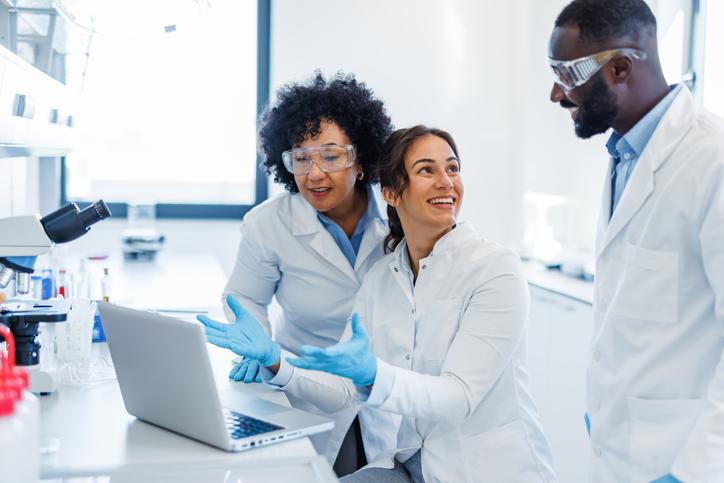 Scientists work together in a lab