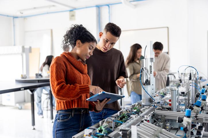 Students discussing a project in a lab