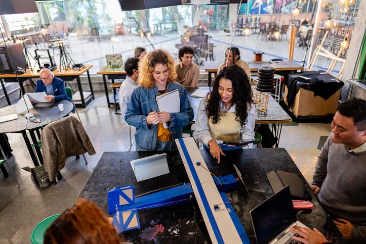 Students developing a model aeroplane at an event