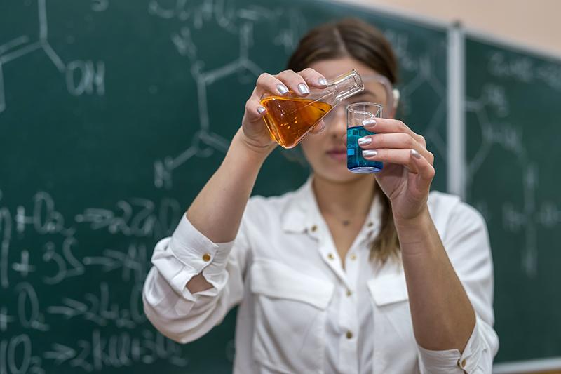 Female teacher doing chemistry demonstration