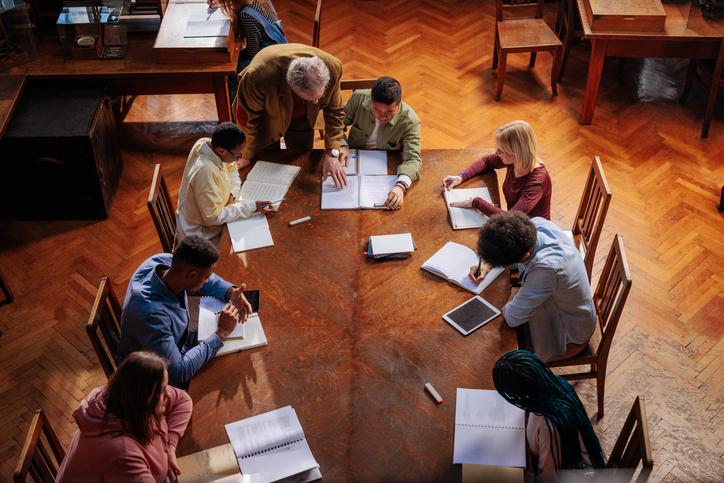 Students study together under the teacher's supervision
