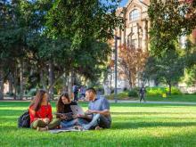 Students sitting on lawn at University of Alberta Canada campus