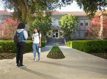 Students standing outside of a campus building at the University of La Verne