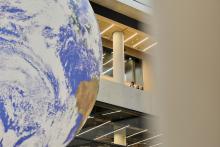 A large globe statue in a campus building