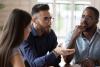 Group of three multiracial people talking