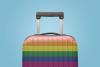 A suitcase decorated in rainbow stripes