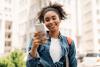 A university student on her phone outside a campus building