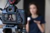 A teacher filming herself giving video feedback for her students