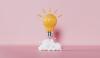 A lightbulb against a pink background