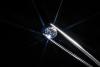 Diamond held in tweezers