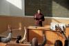 A lecturer standign at the front of class
