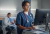 Nurse entering information into computer