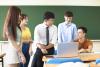 A teacher with students in a classroom