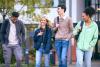 Students walking through campus laughing