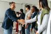 A business professional shakes hands