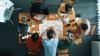 Top down view of colleagues sat around a table planning