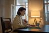 A woman studying at her laptop