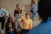 A student raising his hand in class