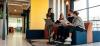 Young entrepreneurs chat happily in a breakout space
